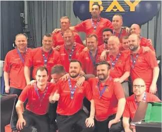  ??  ?? Team effort East Kilbride’s Superleagu­e squad with their medals after earning promotion