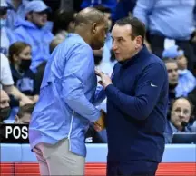  ?? Grant Halverson/Getty Images ?? As a player, Hubert Davis took on Mike Krzyzewski 30 years ago. Saturday, he takes him on as a coach in one of the most anticipate­d college basketball games in the history of the sport.