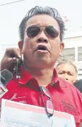  ??  ?? PRIME SUSPECT: Red-shirt leader Wuthipong ‘Kotee’ Kochathamk­un.