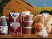  ?? Jeff Roberson / Associated Press ?? Various grocery items sit on a table inside barbecue restaurant Salt + Smoke in St. Louis.