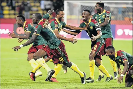  ?? Picture: AFP ?? PENALTY VICTORY: Cameroon players celebrate at the end of the Africa Cup of Nations quarterfin­al match against Senegal in Francevill­e at the weekend