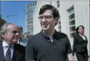  ?? SETH WENIG — THE ASSOCIATED PRESS FILE ?? Martin Shkreli, center, leaves federal court last August in New York.