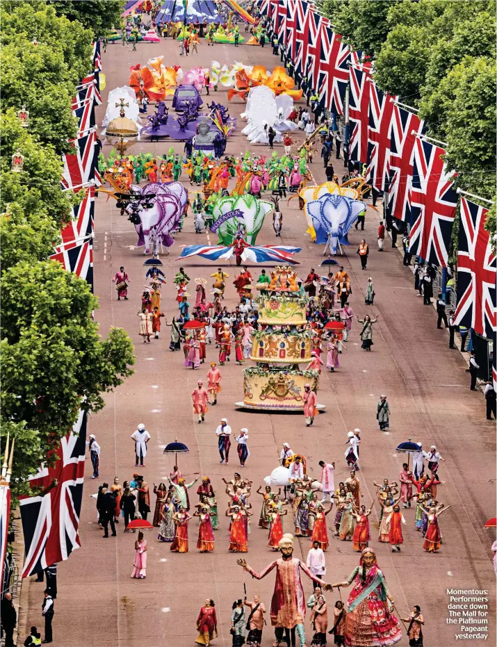  ?? ?? Momentous: Performers dance down The Mall for the Platinum Pageant yesterday