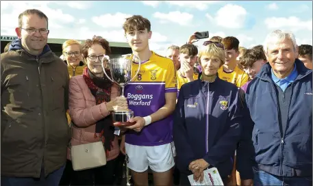  ??  ?? The new Hughie Foley Memorial Cup is presented to Emmett Nolan, the Faythe Harriers captain, by Anne Foley, with Alan Aherne (Group Sports Editor, People Newspapers) and Coiste na nOg officers Angela McCormack and Bobby Goff looking on.