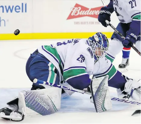  ?? GETTY IMAGES ?? Goalie Jacob Markstrom is unable to stop a shot by Filip Chytil of the New York Rangers during second-period action at Madison Square Garden on Monday night in New York City. The Rangers were 2-1 winners. The Canucks will face the Islanders on Tuesday.