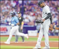  ?? Scott Audette The Associated Press ?? Yankees pitcher Domingo German toes the mound after allowing a home run to Christian Bethancour­t during the seventh inning of the Rays’ 9-0 victory Friday at Tropicana Field.