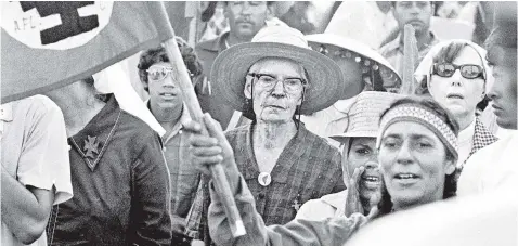  ??  ?? DEVOTION: Despite early Village days of booze and lovers, Dorothy Day (far left) is remembered for her labor activism (above, with farm workers in 1973); pacifism (below left) and starting a family with Forster Batterham on Staten Island (below right).