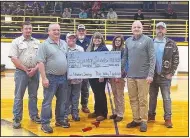  ?? ?? Tyson Foods River Valley Ingredient­s facility in Scranton has donated $80,000 to the Scranton School District to assist with the purchase and installati­on of new chairback bleacher seating for Rocket Arena, the school’s basketball gym. The donation from Tyson Foods RVI Scranton was presented to school administra­tion between basketball games on Feb. 7. Bleacher installati­on will begin after the May 11 graduation ceremony and is slated to be complete by August. Pictured (from left) are Keith Yovonavich, Tyson Scranton plant manager; Frank Fox, Tyson Scranton complex manager; Sharron Johnson, Tyson Scranton general production manager; Mike Kohler, Tyson Scranton general production manager; Irene Sisk, Tyson Scranton materials specialist; Jennifer Schluterma­n, Tyson Scranton senior HR partner; Bill Watkins, Scranton High School principal; and William Howard, Tyson Scranton manager of fleet operations. (Courtesy Photo)