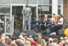  ?? Phil Long / Associated Press ?? James, who signed with the Lakers after a second stint with the Cavaliers, speaks during the school’s opening ceremony.