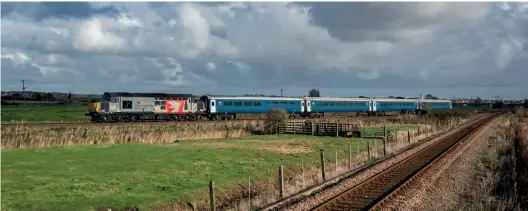  ?? Al Pulford ?? Rail Operations Group’s 37611 Pegasus passes Breydon Junction, near Great Yarmouth, on November 4, 2022, working 5E11, the 11.30 Yarmouth to Keighley stock move in connection with a filming contract taking place on the Keighley & Worth Valley Railway. This was the first outgoing Eastern Rail Services stock working by rail from their Great Yarmouth base.