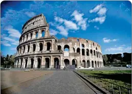  ?? PTI ?? A man pedals in front of an empty area outside Rome's ancient Colosseum due to measures avoiding public gatherings to prevent the spread of Covid-19, Thursday