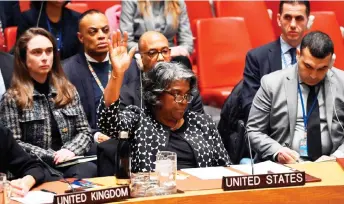  ?? — AFP photo ?? Thomas-Greenfield casts a veto vote during a UN Security Council meeting on the Israel-Hamas war, at UN Headquarte­rs in New York City.