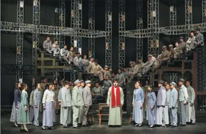  ?? PHOTOS PROVIDED TO CHINA DAILY ?? Baritone Zhou Zhengzhong (center) rehearses the role of student revolution­ary Lu Jiachuan in TheSongofY­outh, an opera adaptation of the well-known novel. It will premiere at the National Centre for the Performing Arts from Thursday to May 1.