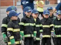  ?? MARIAN DENNIS – DIGITAL FIRST MEDIA ?? Campers listened attentivel­y as they learned all about fire fighters and first responders. The week-long camp help at Limerick Fire Company welcomed 135 kids into the program this year.