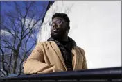  ?? STEVEN SENNE — THE ASSOCIATED PRESS ?? Somerville City Councilor Willie Burnley Jr. stands near the Prospect Hill Monument in Somerville, Mass., on Feb. 1. Somerville could follow the lead of an increasing number of municipal, county and state government­s and use federal pandemic relief funds to pay residents' burdensome medical debt.