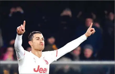  ?? AFP ?? Juventus’ Portuguese forward Cristiano Ronaldo celebrates after scoring a goal during the Italian Serie A football match on Saturday at the Marcantoni­o Bentegodi Stadium in Verona.