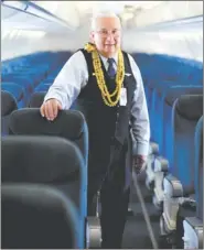 ?? JAMIE SCHWABEROW / THE NEW YORK TIMES ?? Ron Akana, 83, a flight attendant for United Airlines, stands aboard a plane at Denver Internatio­nal Airport last month.
