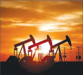  ?? (Odessa American/Eli Hartman) ?? The sunset is seen behind an array of pump jacks Friday outside Midland, Texas.