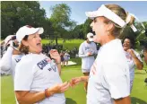  ?? Stuart Franklin / Getty Images ?? U.S. captain Juli Inkster (left) celebrates with Lexi Thompson after the Americans clinched the Solheim Cup on Sunday.