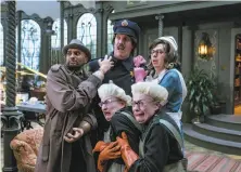  ?? Joe Lederer / Netflix ?? Count Olaf (Neil Patrick Harris) is surrounded by sycophants aiding him on his quest to capture the orphans’ fortune.