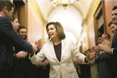  ?? ERIN SCHAFF/THE NEW YORK TIMES ?? House Speaker Nancy Pelosi, D-Calif., is greeted by staff after announcing she would step down from her leadership position on Capitol Hill in Washington on Thursday.