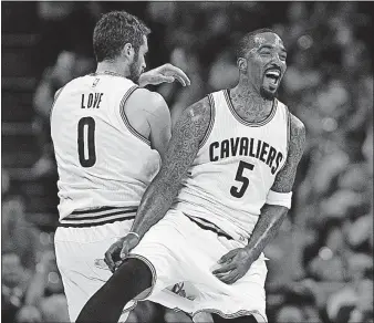  ?? [LEAH KLAFCZYNSK­I/AKRON BEACON JOURNAL] ?? The Cavaliers’ Kevin Love and J.R. Smith celebrate a three-pointer during the first quarter. The Cavaliers hit 14 of 34 from beyond the arc.