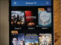  ?? ANDREW HARRER / BLOOMBERG ?? The Vudu app is used Wednesday on an iPhone. Vudu, Walmart’s video-on-demand service, has languished since the retailer bought it eight years ago.