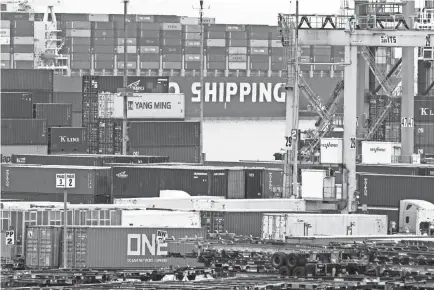  ??  ?? Shipping containers arrive in Los Angeles on May 13. The U.S. imports $250 billion from China.