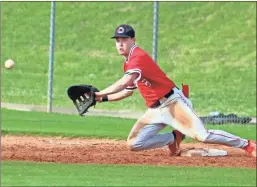  ?? Jeremy Stewart ?? Cedartown’s Cole Dingler stretches to make a catch at first for an out during Game 1 against Cairo in the second-round state playoff series at Cedartown High School on Tuesday, May 3.