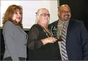  ??  ?? FROM LEFT: Marcela Piedra, interim city manger, Carol Reiters, owner of Jim Reiter’s Locksmith &amp; Safe, winner of the Entreprene­ur Award at the IMAGINE Awards ceremony that celebrates city businesses in El Centro on Thursday. WILLIAM ROLLER PHOTO