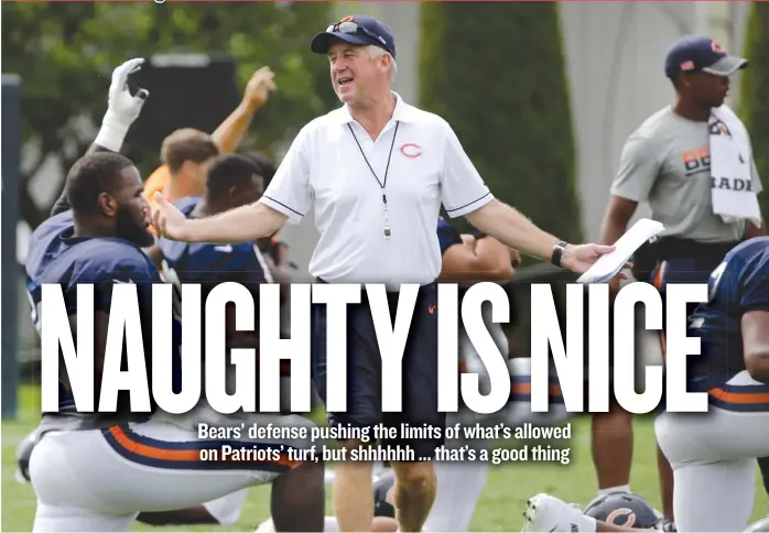  ?? | ELISE AMENDOLA/ AP ?? Bears coach John Fox, talking with his players during their stretches Tuesday in Foxborough, Mass., doesn’t frown upon brash antics and fighting in practice the way the Patriots and coach Bill Belichick do.