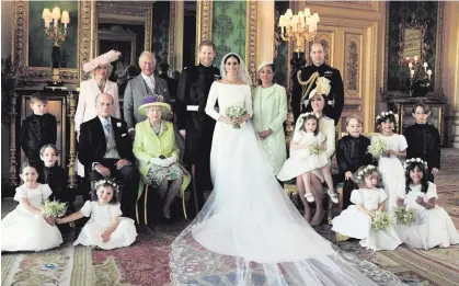  ?? ALEXI LUBOMIRSKI/PA WIRE ?? The official wedding photograph­s of the Duke and Duchess in The Green Drawing Room, Windsor Castle with (back row from left) Jasper Dyer, the Duchess of Cornwall, the Prince of Wales, Doria Ragland, The Duke of Cambridge; middle row: Brian Mulroney,...