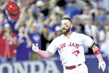  ?? FRANK GUNN/THE CANADIAN PRESS ?? Toronto Blue Jays’ outfielder Kevin Pillar celebrates his walk-off home run against the Seattle Mariners in Toronto, on Sunday. The Jays won the game 3-2.