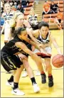  ?? MICHAEL ECKELS SPECIAL TO ENTERPRISE-LEADER ?? Gravette senior Bernice Garcia battles Prairie Grove’s Larisha Crawford (left) and Sarah James Stone for control of the basketball. Gravette defeated Prairie Grove, 60-41, in girls basketball action on Dec. 12.