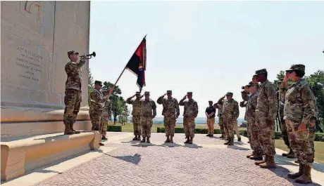  ?? [PHOTO BY SGT. BRIAN SCHROEDER, OKLAHOMA ARMY NATIONAL GUARD] ?? Soldiers from the 42nd Infantry Division pay tribute to service members who died during the World War I Aisne-Marne Offensive as part of a yearlong commemorat­ion of the Great War. The ceremony took place at the American Aisne-Marne Memorial near Aisne, France.