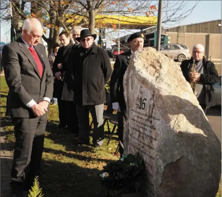  ??  ?? Terry McCann reflects after laying a wreath on the 1916 commemorat­ive stone