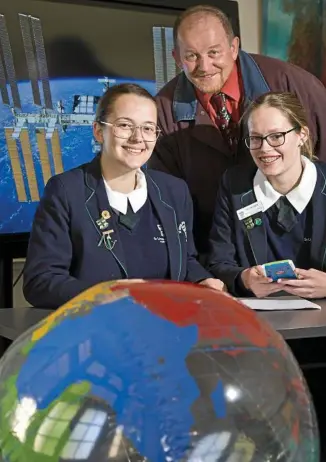  ??  ?? BLAST-OFF: St Ursula’s College students Piper Hofstee (left) and Lucy McGrath, with teacher Steve Broderick, are looking forward to attending space camp at NASA later this year.