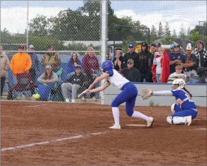  ?? Courtesy of Chris Pedigo ?? Sutter’s Kaylee Duncan lays down a sac bunt earlier this week during a home game against Wheatland. Sutter won the Butte View League over Wheatland and secured the top-seed in the first Northern Section Division IV playoffs since 2019. The Huskies open play Tuesday at home.