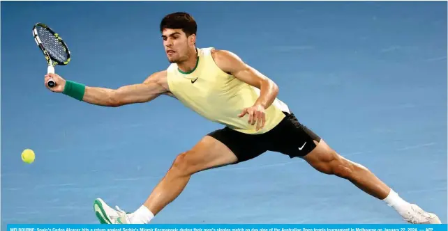  ?? ?? MELBOURNE: Spain’s Carlos Alcaraz hits a return against Serbia’s Miomir Kecmanovic during their men’s singles match on day nine of the Australian Open tennis tournament in Melbourne on January 22, 2024. — AFP