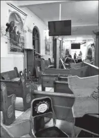  ?? AP/NARIMAN EL-MOFTY ?? Pews are overturned inside the St. George Church after a suicide bombing Sunday in the Nile Delta town of Tanta, Egypt.