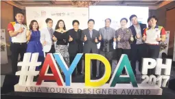  ??  ?? Michael Francisco, Nippon Paint Coatings PH GM (leftmost) and Gladys Goh, Nippon Paint Malaysia Group GM with the judges from the architectu­re and interior design categories of Asia Young Designer Award.