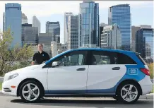  ??  ?? Jon Wycoco, general manager of Car2go, is seen with the four- door Mercedes- Benz B- Class the company will be offering.