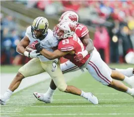  ?? ANDY MANIS/AP ?? Wisconsin linebacker T.J. Edwards tackles Purdue running back Markell Jones on Oct. 14, 2017, in Madison, Wis.