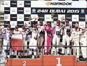  ?? ?? Winning teams of the 28th Hankook 24H Dubai Endurance Race on the podium with their trophies at the Dubai Autodrome in the United Arab Emirates on Sunday.
