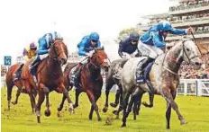  ?? Rex Features ?? Librisa Breeze beats Tasleet (left) and Harry Angel (centre) in the British Champions Sprint Stakes.