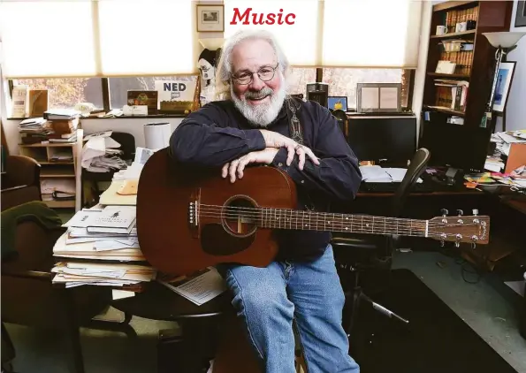  ?? Arnold Gold / Hearst Connecticu­t Media ?? Attorney Steven Mednick photograph­ed in his office in New Haven on Nov. 3, 2022 with his Martin acoustic electric guitar. Below, College Street Music Hall in New Haven photograph­ed on Dec. 3, 2021.