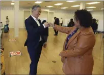  ?? ARIC CRABB — BAY AREA NEWS GROUP ?? California Attorney General Rob Bonta, left, fist bumps his wife, Assemblyme­mber Mia Bonta, after the couple dropped off their ballots at a voting center on Nov. 8 in Alameda.