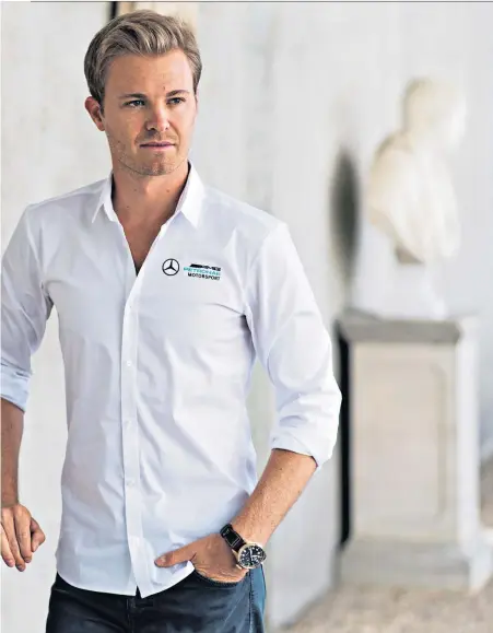  ??  ?? New chapter: Nico Rosberg in relaxed mood with Oliver Brown during the Goodwood Festival of Speed. The world champion insists life after Formula One is ‘awesome’