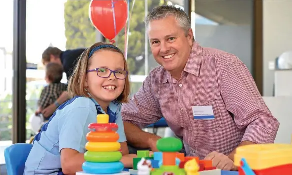  ?? PHOTO: KEVIN FARMER ?? NEW CENTRE: Clinton Williams and daughter Ella at the opening of the RIDBC Clive Berghofer Centre in Toowoomba.