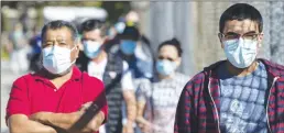  ?? Los Angeles Times/tns ?? People wait in line at a walk-up COVID-19 testing site at San Fernando Recreation Park Tuesday in San Fernando.